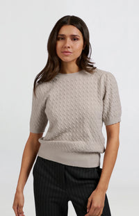 Knitted sweater with short sleeves and cable pattern