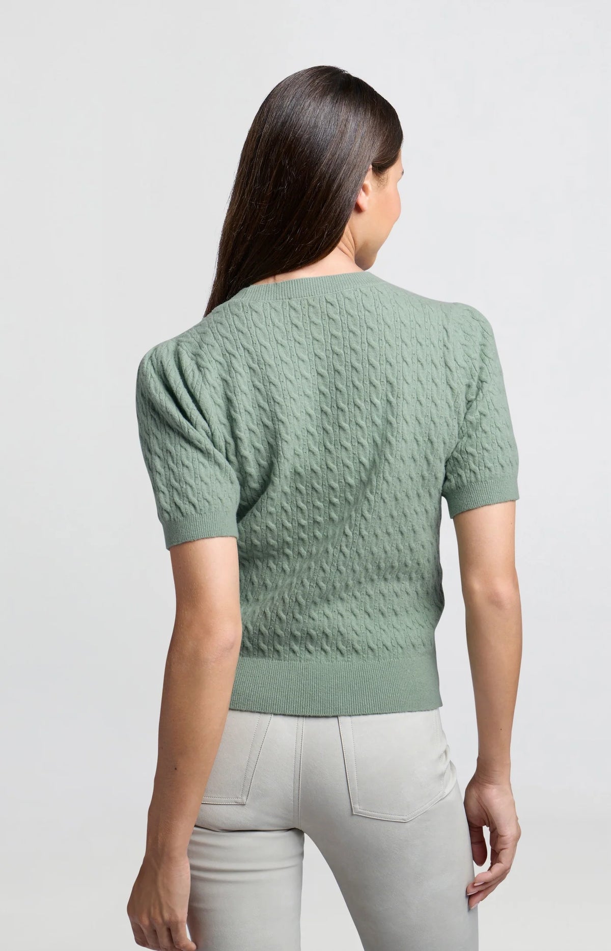 Knitted sweater with short sleeves and cable pattern