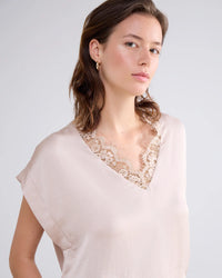 Sleeveless top with lace V-neck