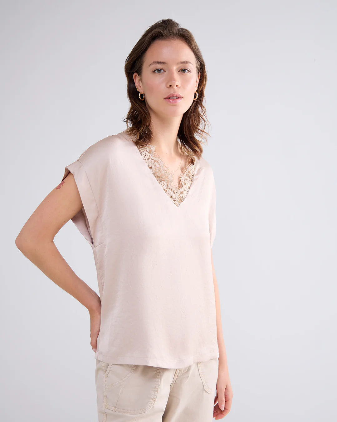 Sleeveless top with lace V-neck