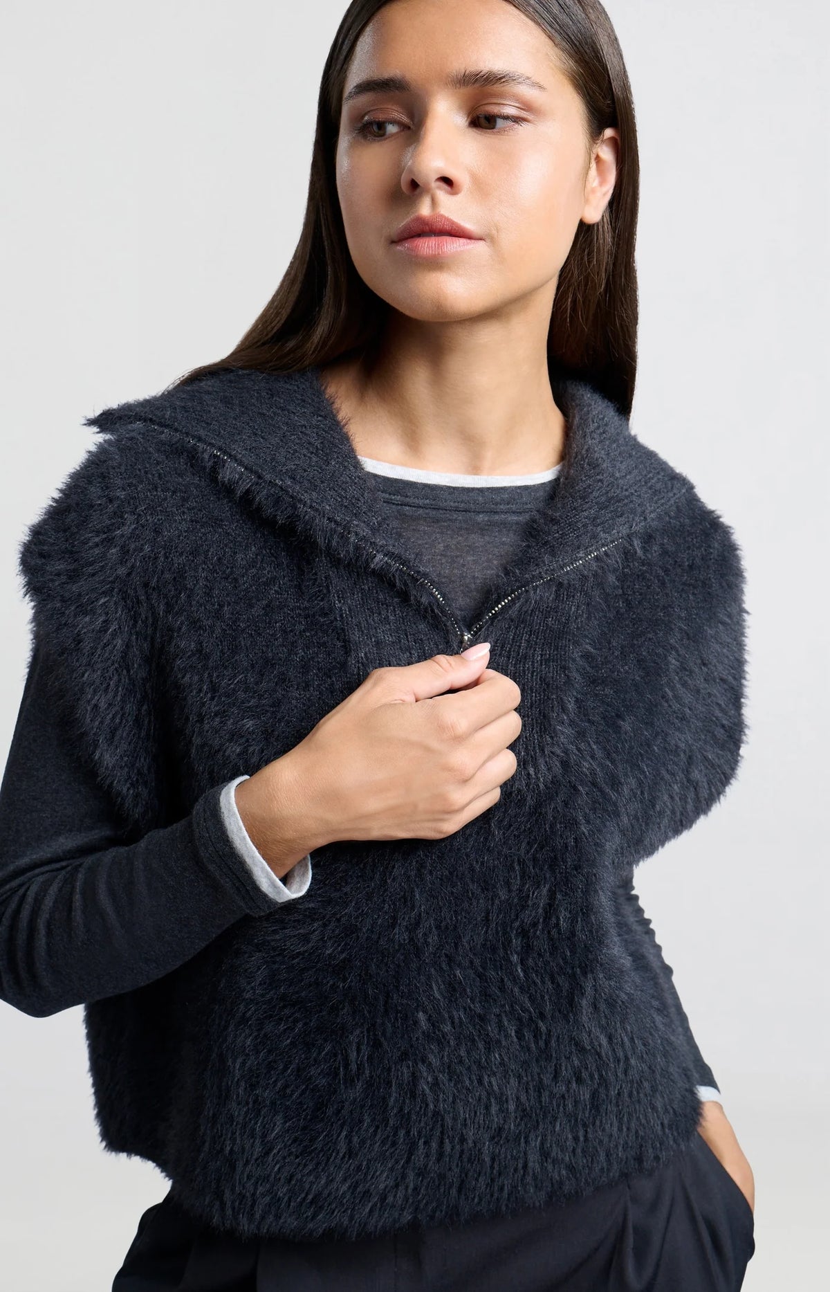 Sleeveless sweater with half zipper