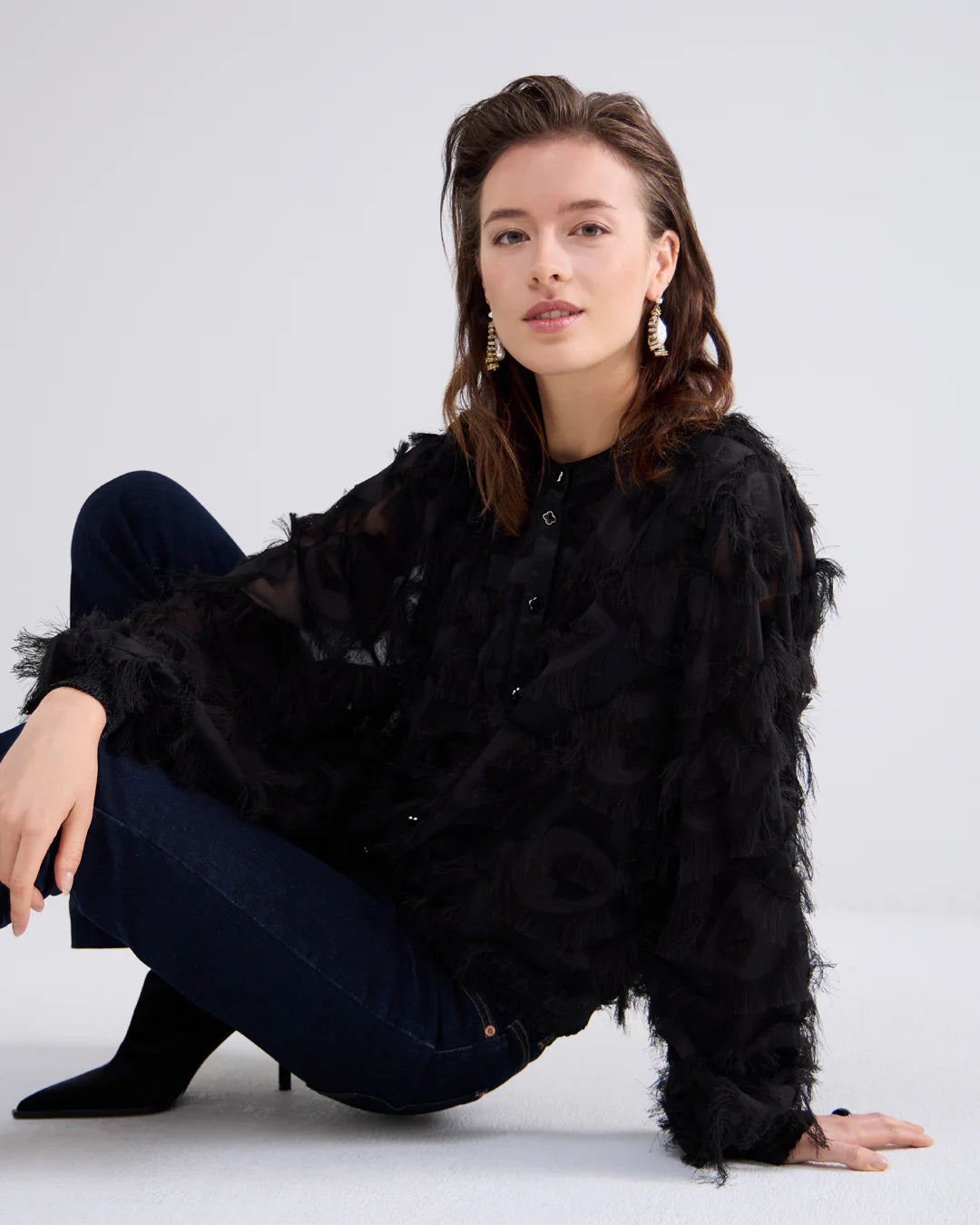 Fluffy blouse with fringe