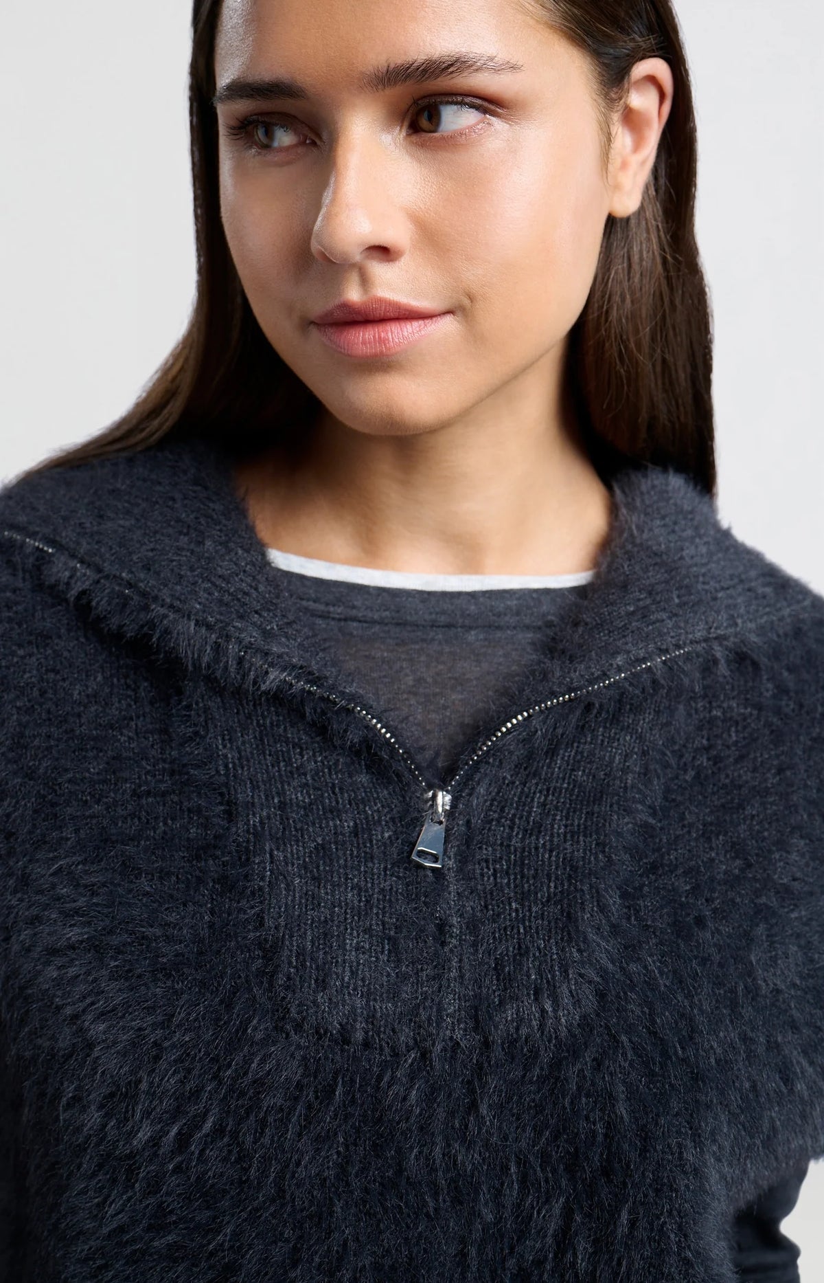 Sleeveless sweater with half zipper